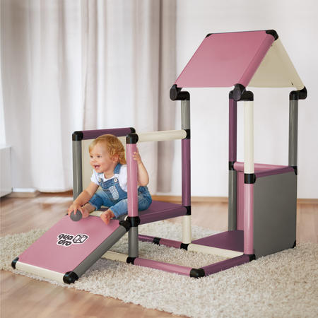 Child sitting on a playhouse ramp